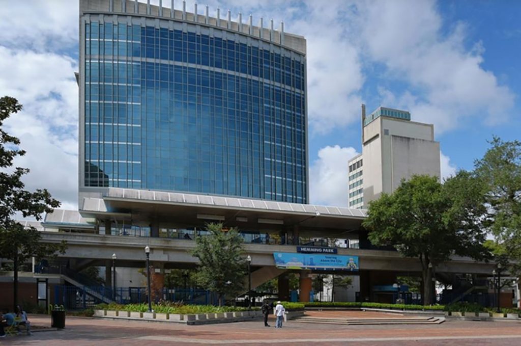 Developer buys downtown Jacksonville high-rise for luxury apartments, upscale rooftop restaurant, & grocery.